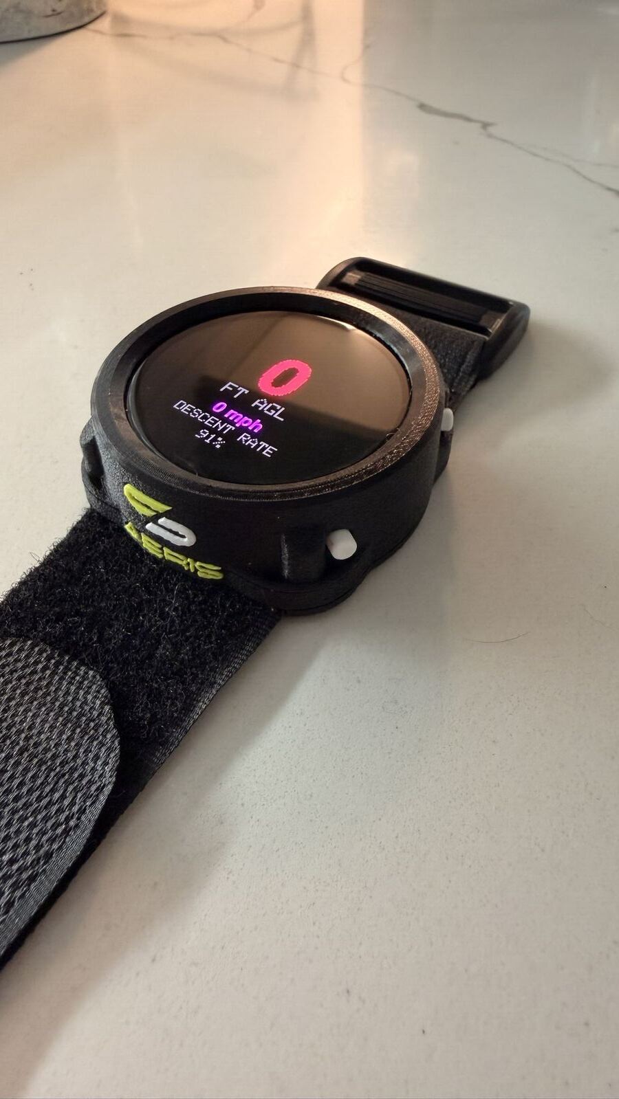 AERIS altimeter mid-readout showing altitude and descent rate